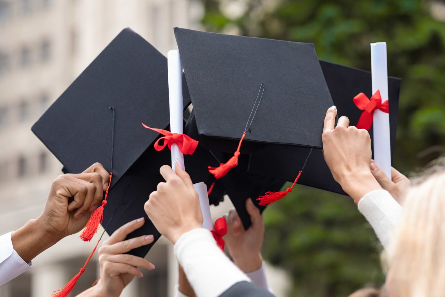 graduation-hats-and-diplomas-in-students-hands-cl-2023-11-27-05-10-15-utc-compressed