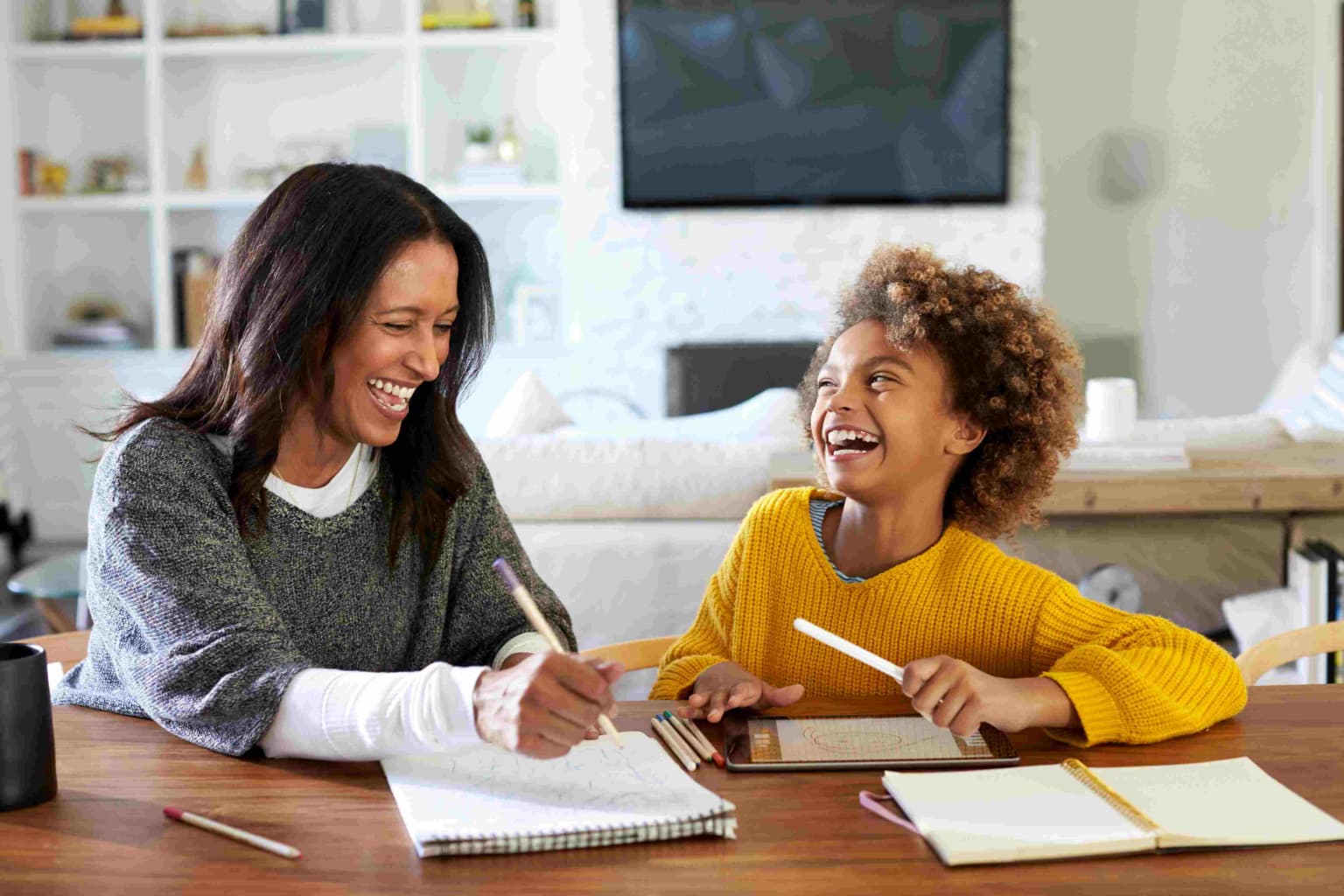 mixed-race-woman-sitting-at-a-table-doing-homework-2023-11-27-05-19-08-utc-compressed