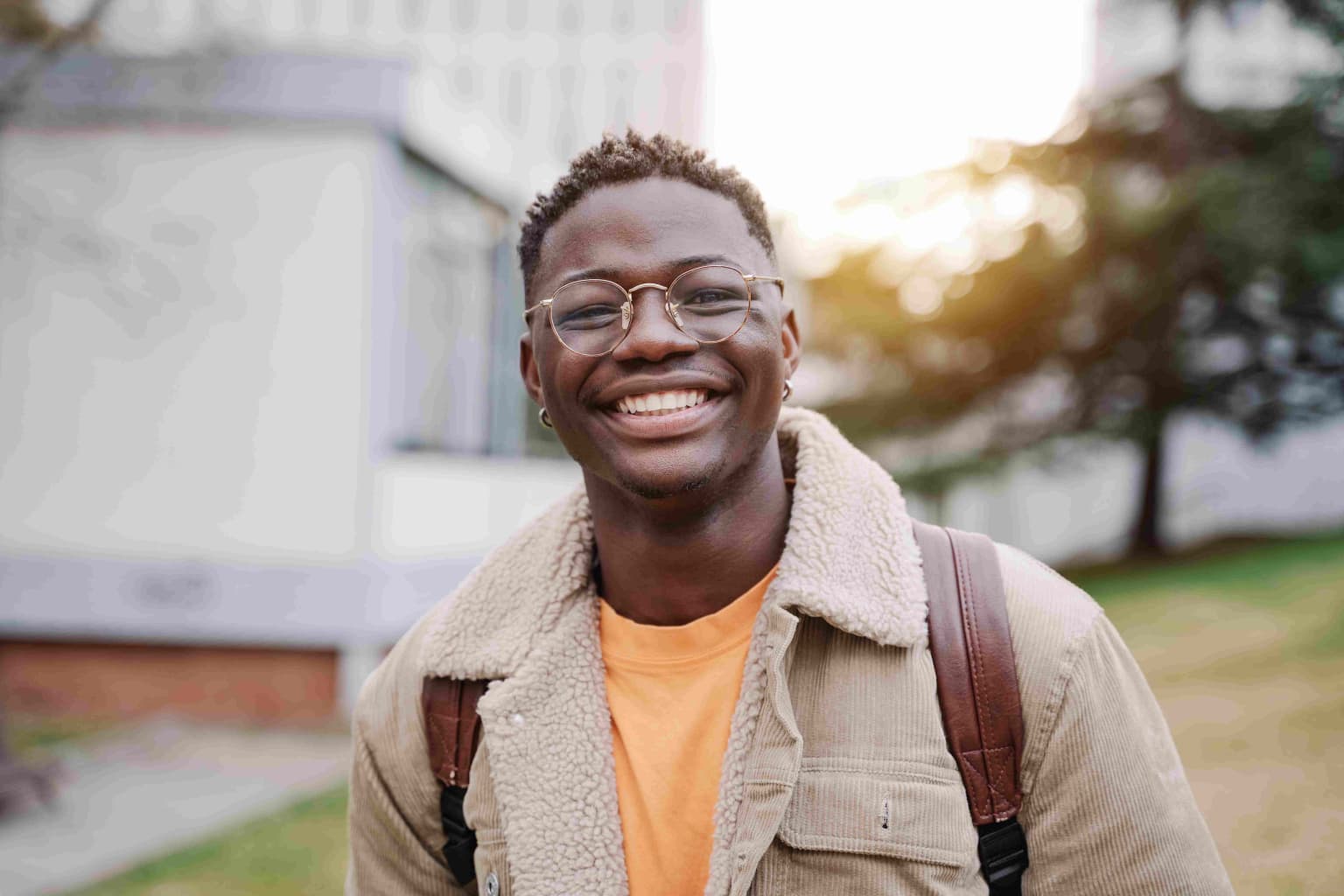 portrait-of-positive-happy-african-american-male-s-2023-11-27-04-57-42-utc-compressed