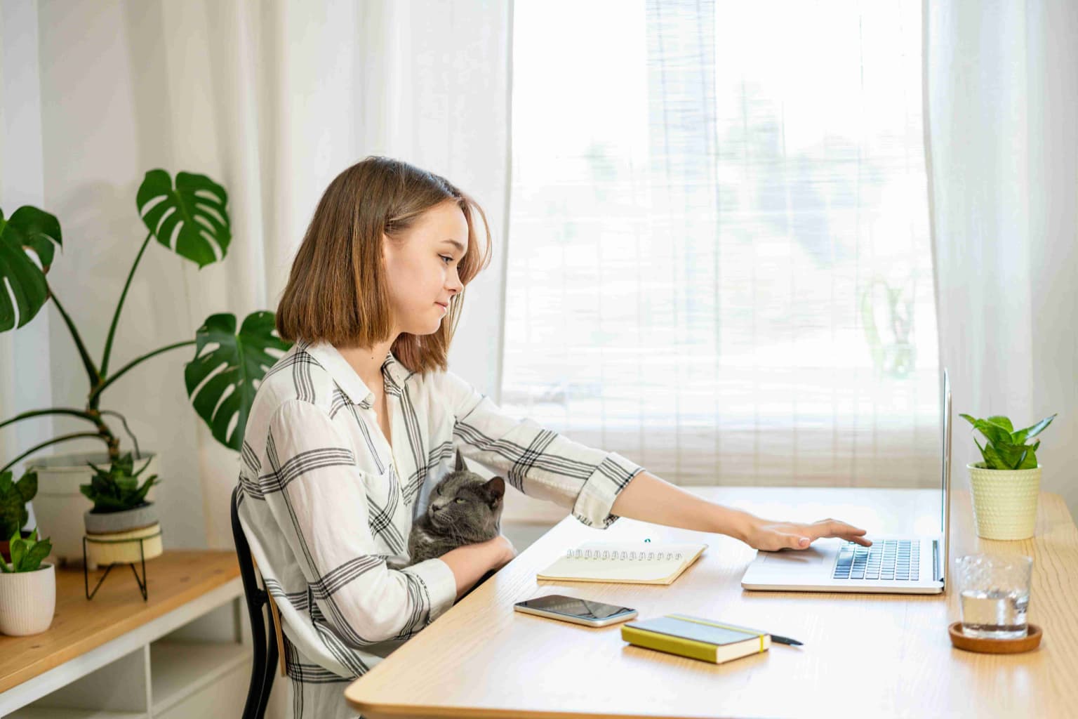 young-woman-working-on-laptop-at-home-cozy-home-o-2023-11-27-05-24-08-utc-compressed