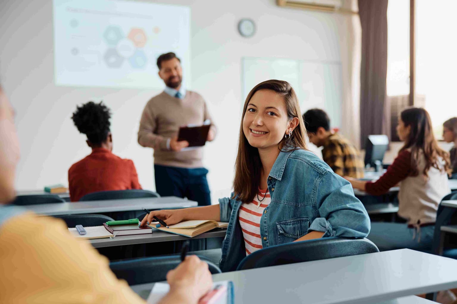 happy-college-student-during-a-lecture-in-the-clas-2023-11-27-05-24-30-utc-compressed