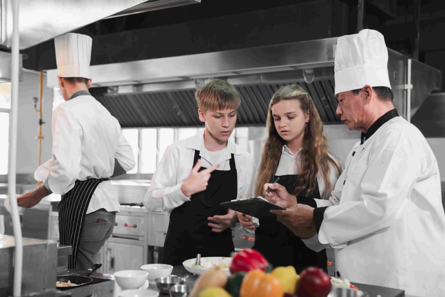 chef-and-students-cooking-and-preparing-food-in-ki-2023-11-27-05-26-28-utc-compressed